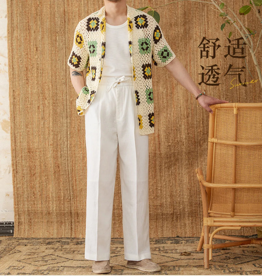 Women's loose fit high waist linen trousers in greige colour with straight leg and elasticated waistband.
