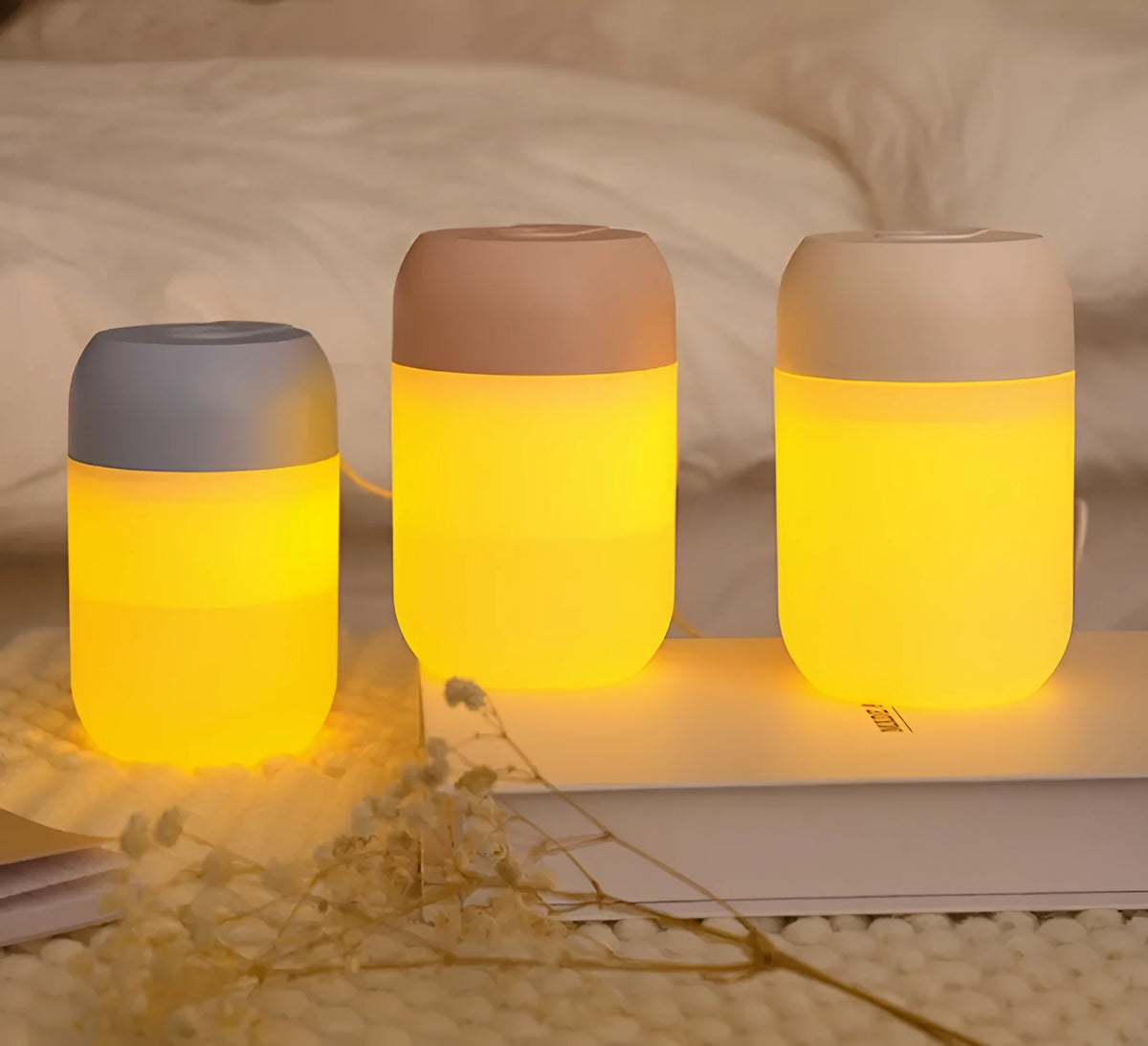Small white cylindrical USB-powered humidifier on a desk