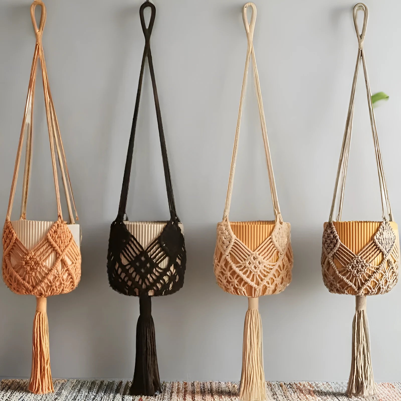 Hand-woven brown polyester cotton net pocket extension cord on a grey flower pot.