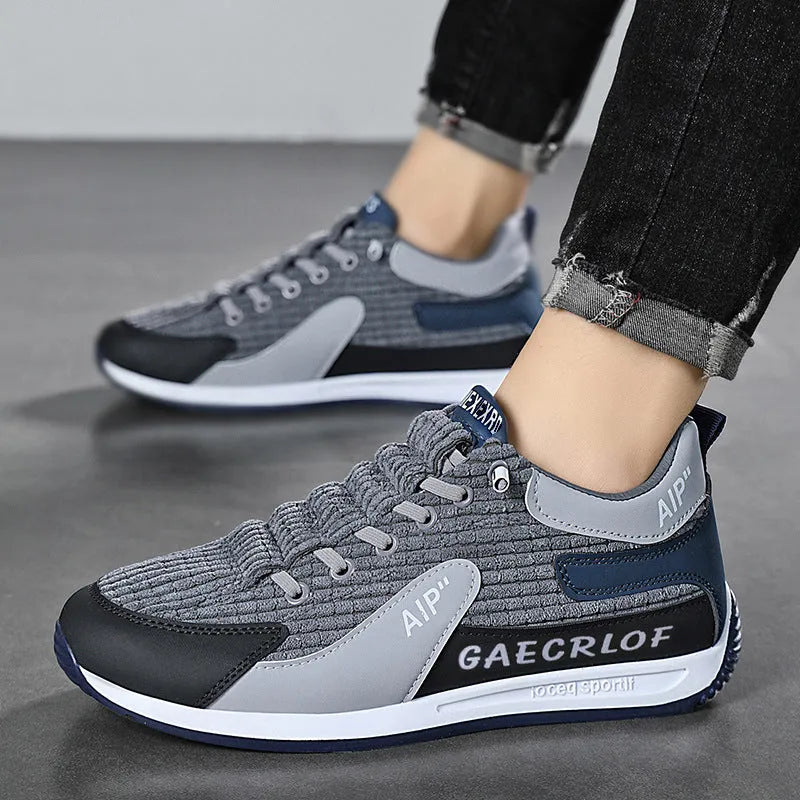 Men's low-top green and grey mesh running shoes with lace-up front.