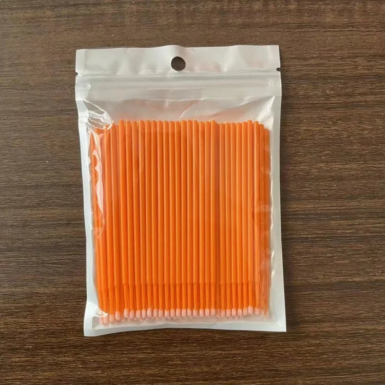Disposable micro applicator brushes with bendable cotton tips and colour-coded handles for eyelash extensions