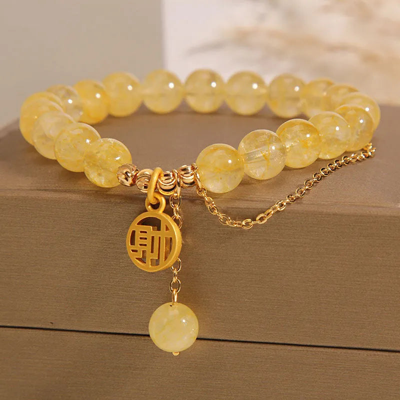 Natural citrine stone bracelet with electroplated metal and Chinese character tassel charm