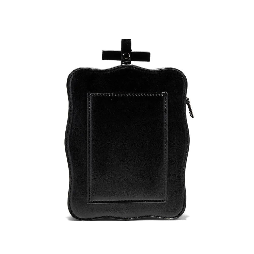 Black Halloween skull shoulder bag with embossed design, chain strap, and vertical square messenger shape