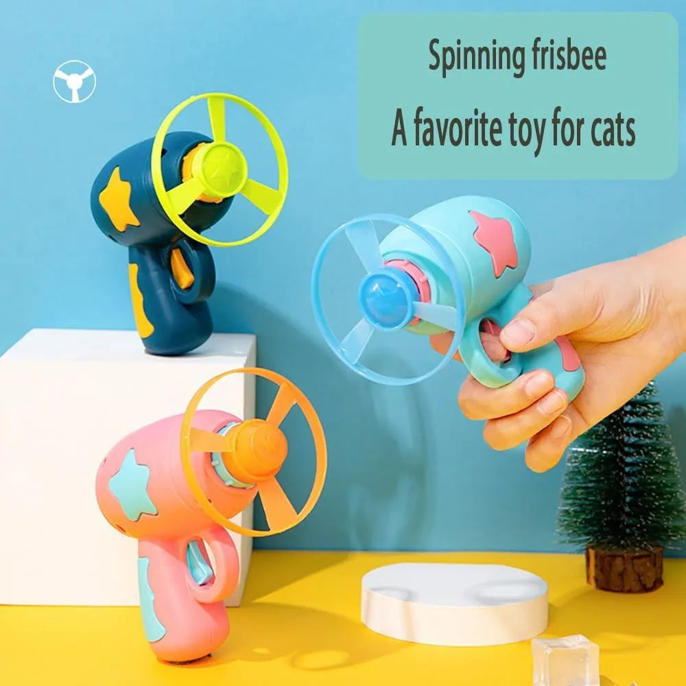 Blue plastic cat toy gun with spinning mechanism and flying disc for indoor feline play
