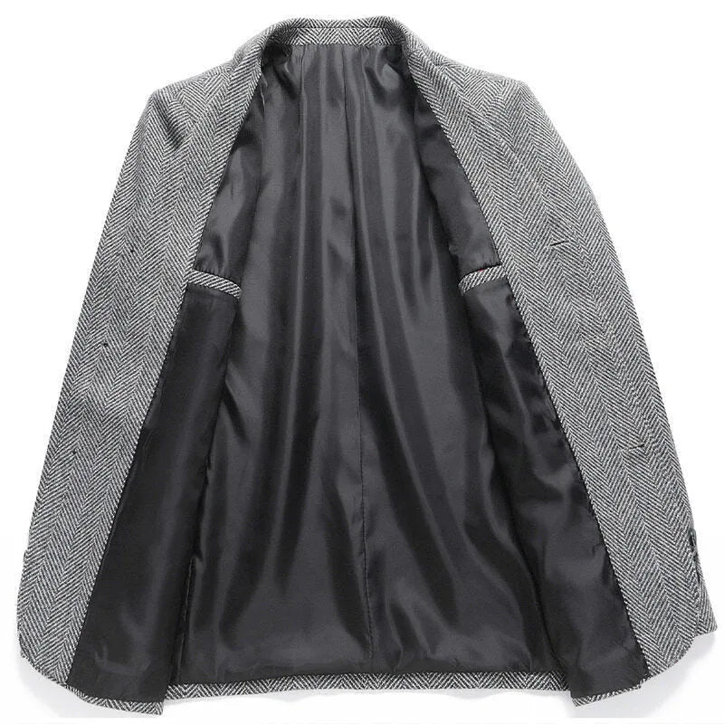 Man wearing a classic solid-colour, loose-fit wool blend coat suitable for spring and autumn.