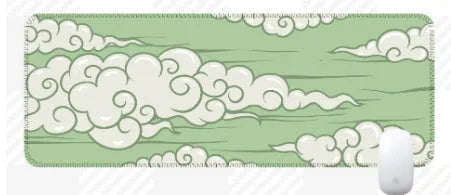 Large rectangular cloud pattern mouse pad and desk mat in natural rubber on a wooden desk.