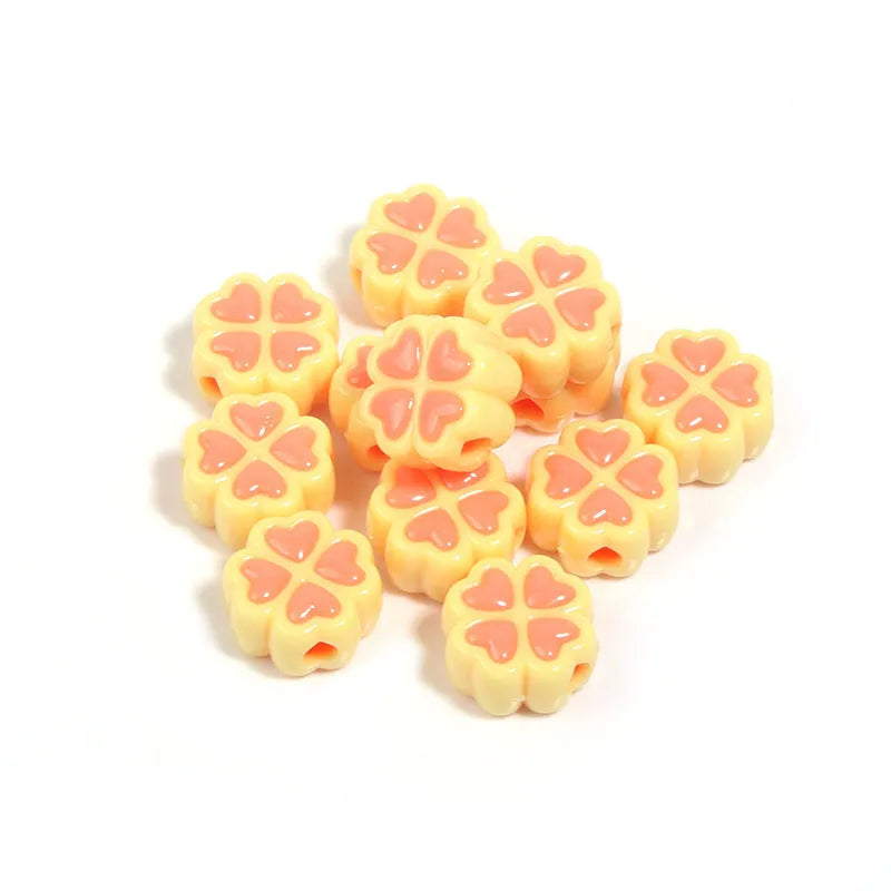 Acrylic four-leaf clover love beads with frosted finish in assorted light colours, 15mm size