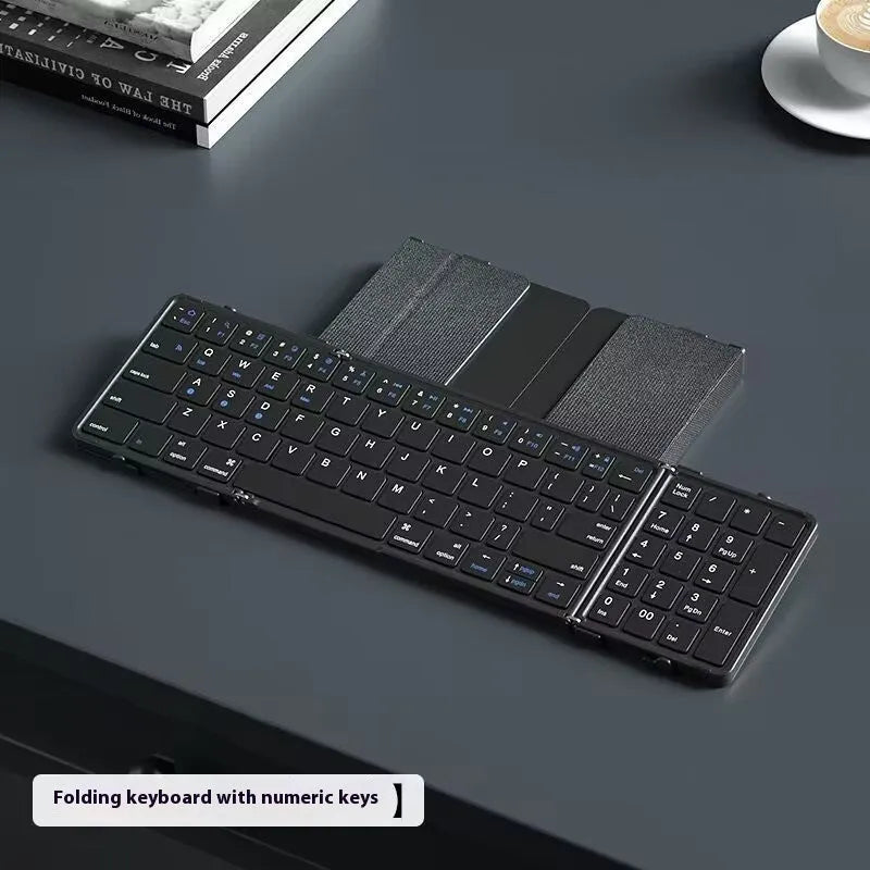 Black foldable Bluetooth keyboard for mobile devices with mute keys