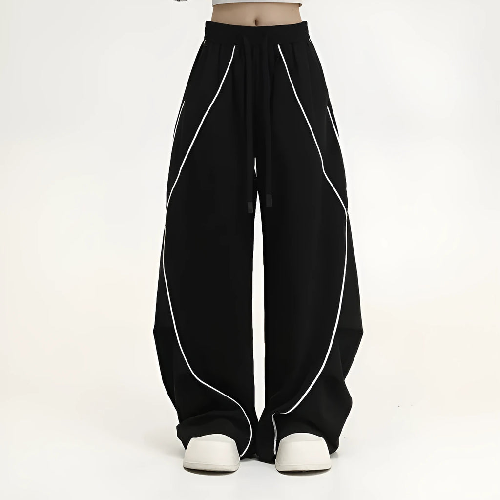 Black pleated wide-leg hip hop pants with striped pattern and mid-waist design made of polyester