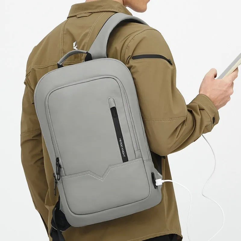 Men's business backpack in Oxford cloth with USB interface, solid colour, gray or blue, under 20L