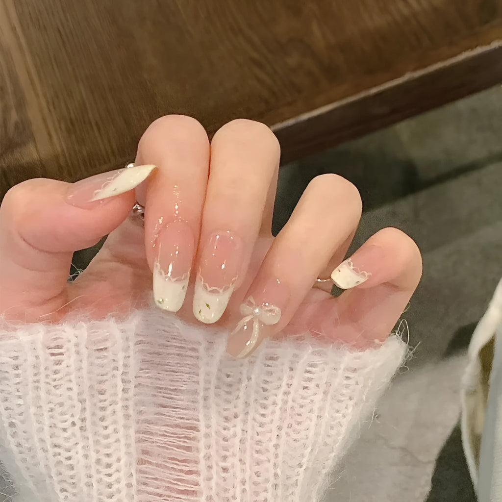 Five sets of short square shaped press-on fake nails with a peel-and-stick backing, shown in assorted colours.