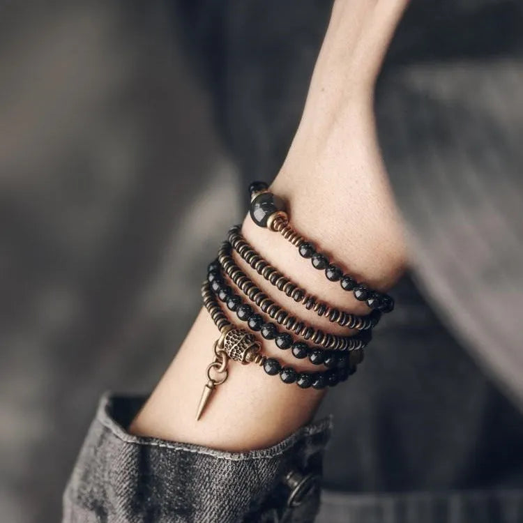 Black geometric beaded bracelet with colourful multi-layered retro design and adjustable cord