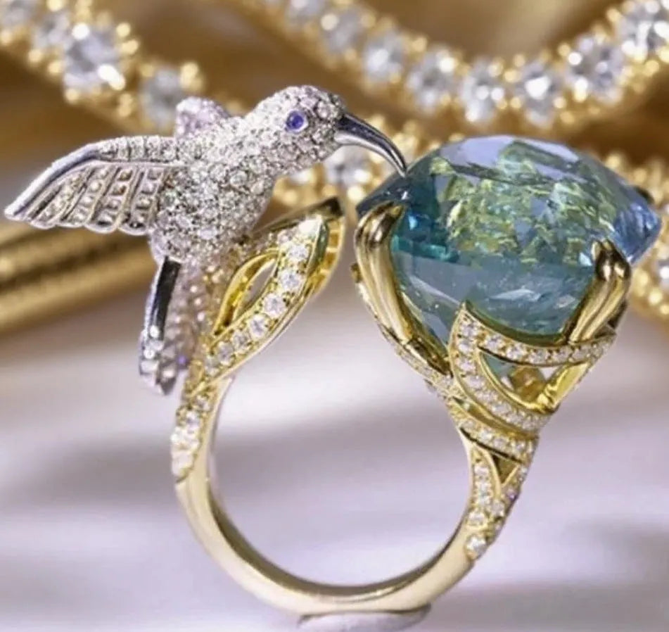 Ocean blue topaz hummingbird open ring with real gold colour adjustable brass band