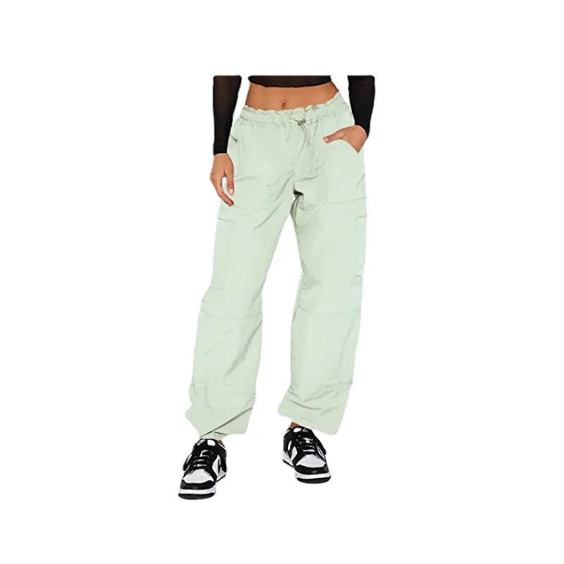 Man wearing loose-fit khaki coloured cargo pants with multiple pockets, straight leg design.