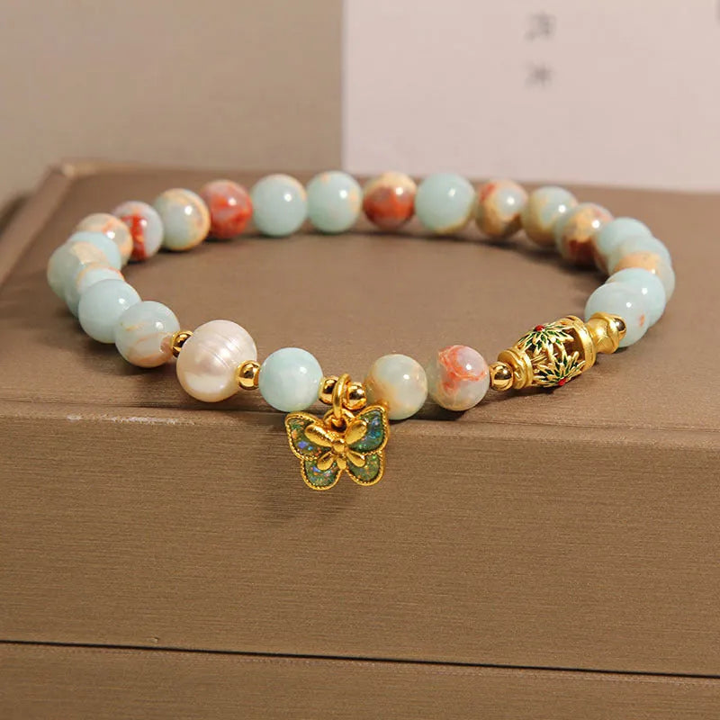 Blue women's bracelet with butterfly pendant, freshwater pearl, and Shoushan Stone elements