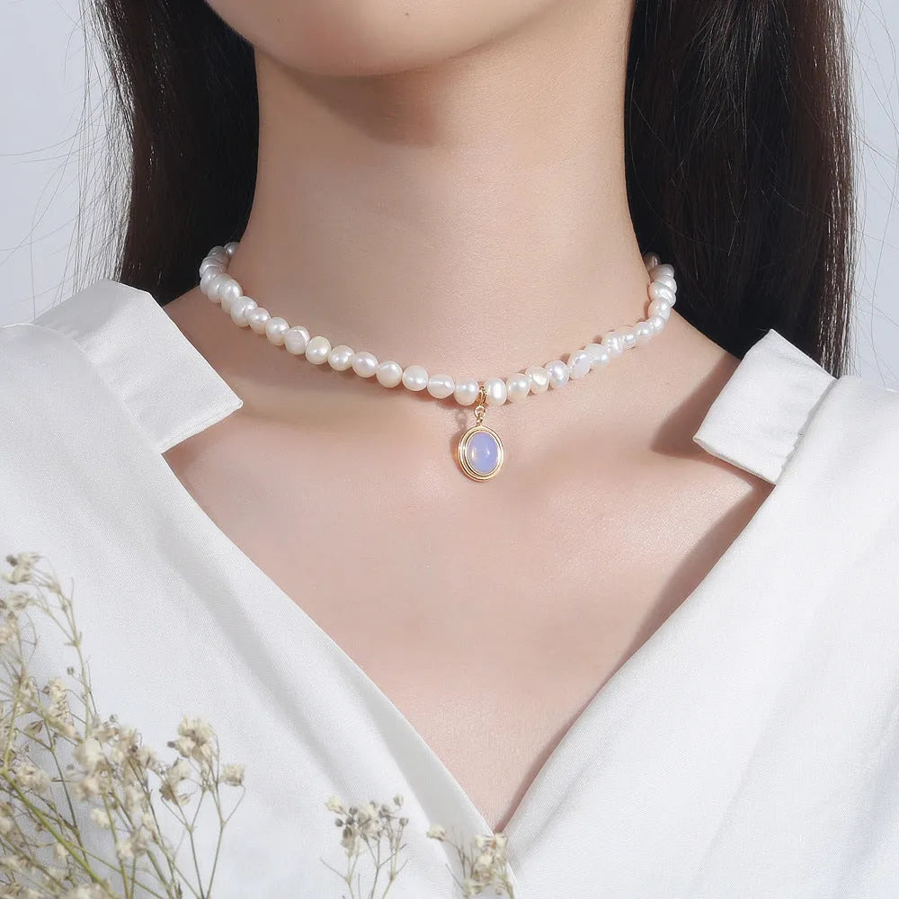 Geometric sterling silver pendant necklace with irregular freshwater pearls on an adjustable silver chain