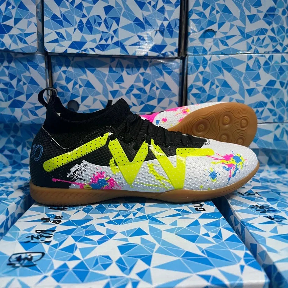 Low-top men's football boots in black and yellow with a PVC upper and rubber studded outsole.