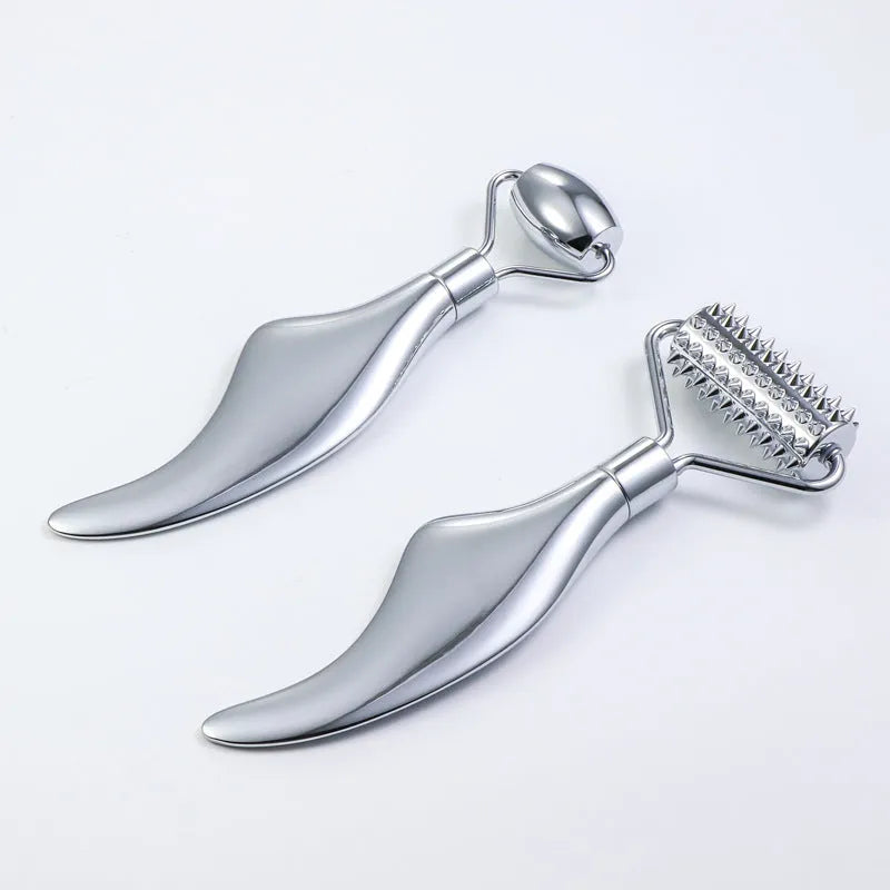 Stainless steel facial massage board with double-head roller, scraping plate, and heart-shaped eye poking stick