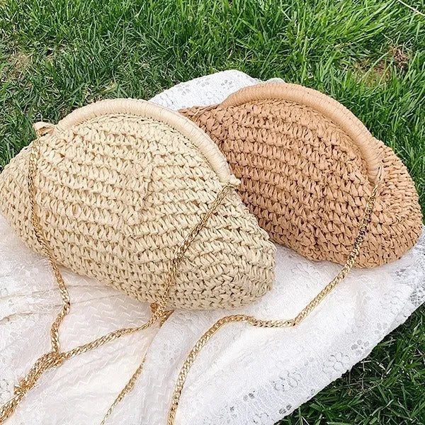 Women's woven paper straw beach bag with shoulder chain in khaki colour showing interior zip pocket