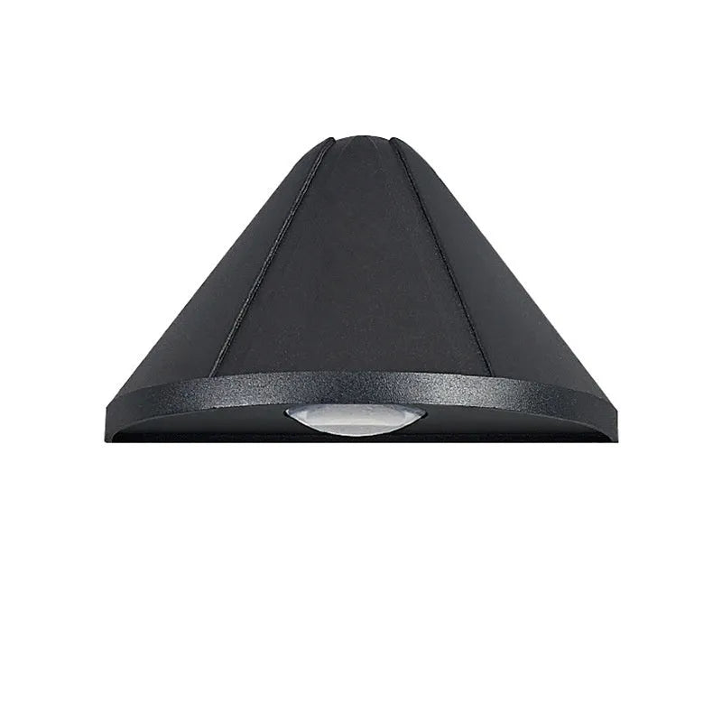 Black bird's nest design LED courtyard lamp with IP65 waterproof rating on a garden wall.