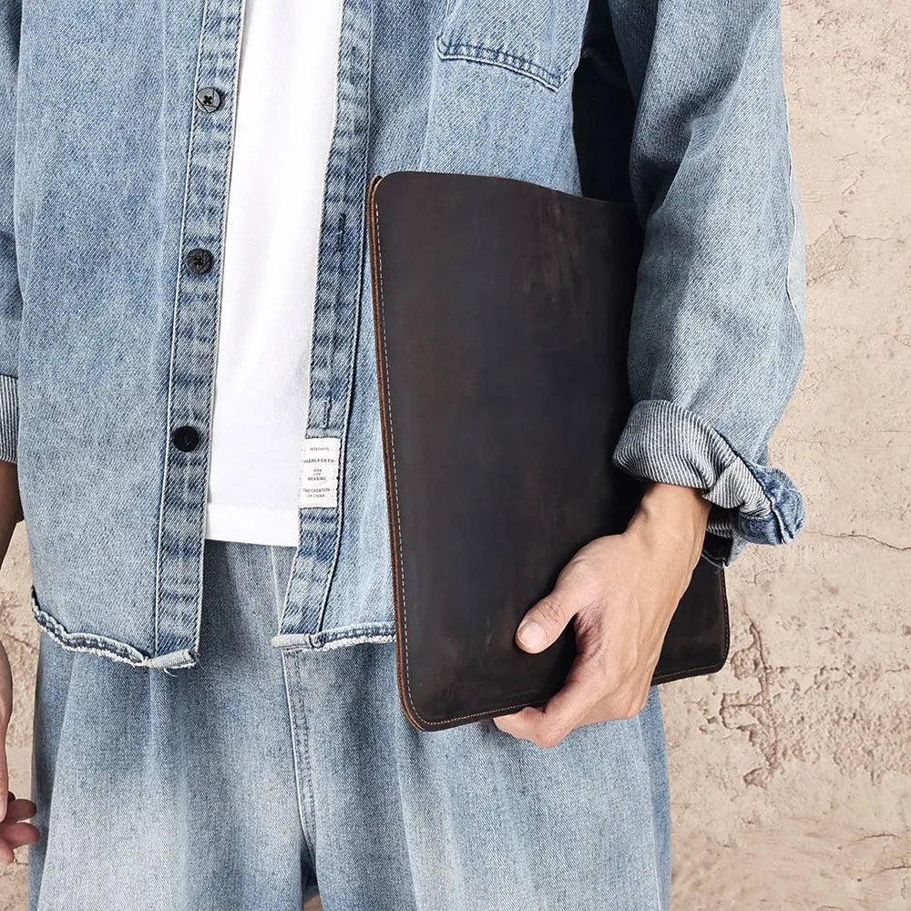 Computer liner bag in crazy horse leather with cowhide construction showing medium brown colour option