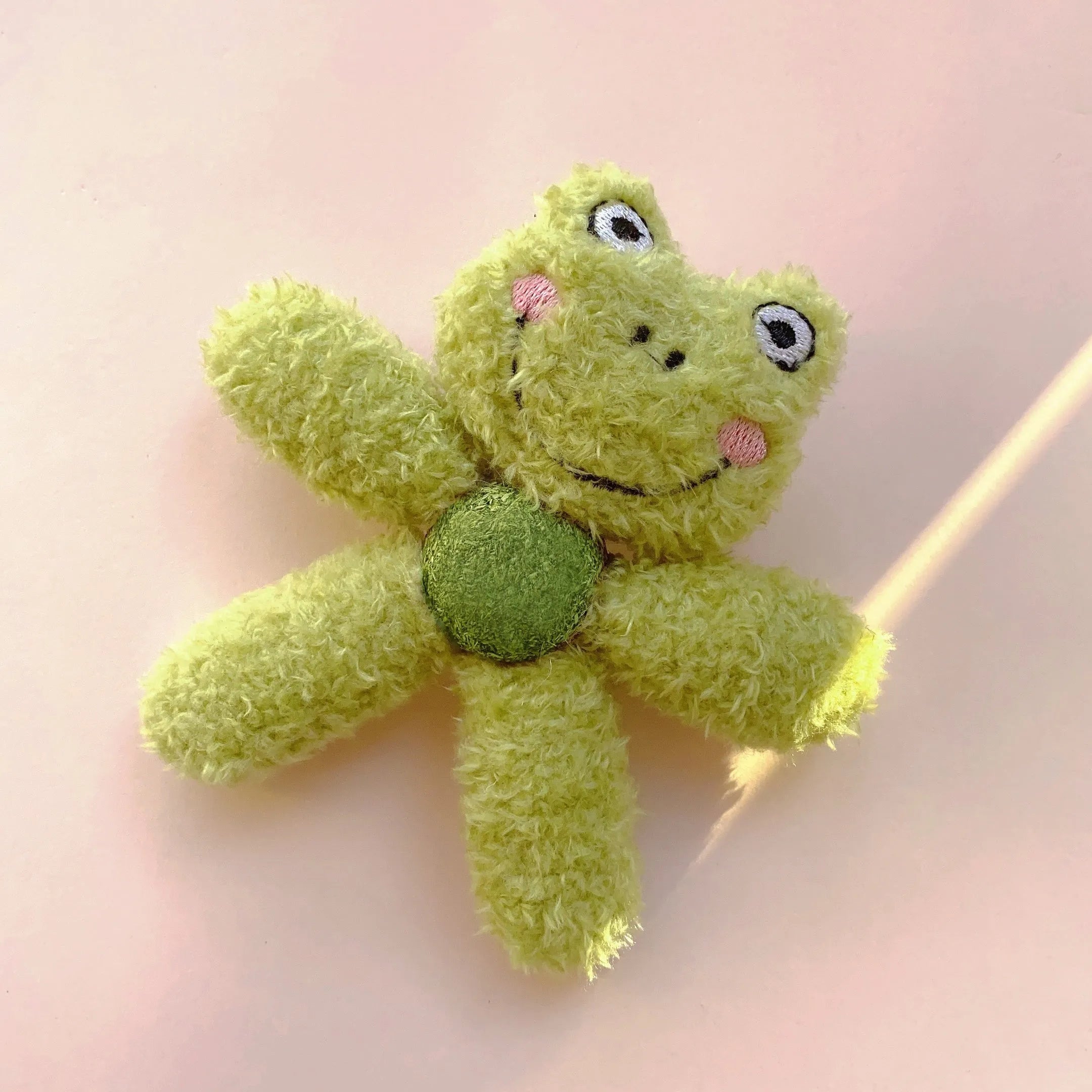 Plush catnip ball chewing toy in animal designs for dental care, showing scale next to a 12.5 cm ruler.