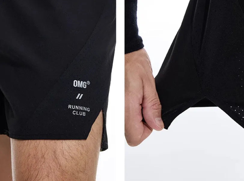 Men's black four-point stretch running shorts with laser-stitched seams on a grey background.