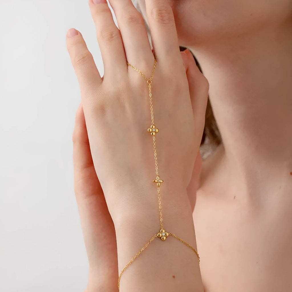 Gold-coloured women's bracelet with geometric flower and eight-pointed star design