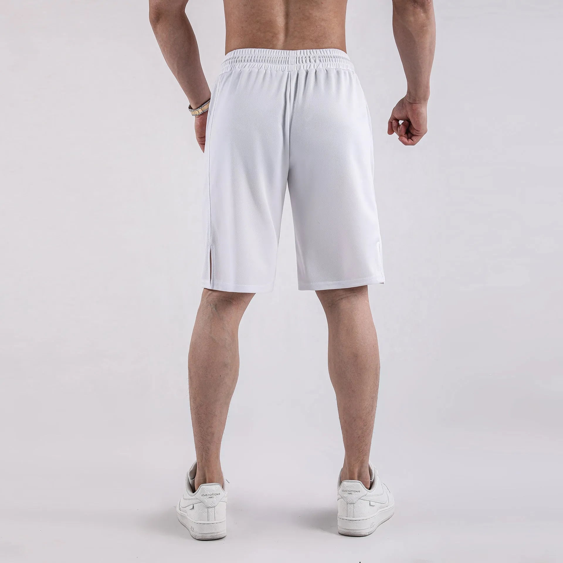 Men's black quick-dry mesh fitness shorts with elastic waistband and loose fit