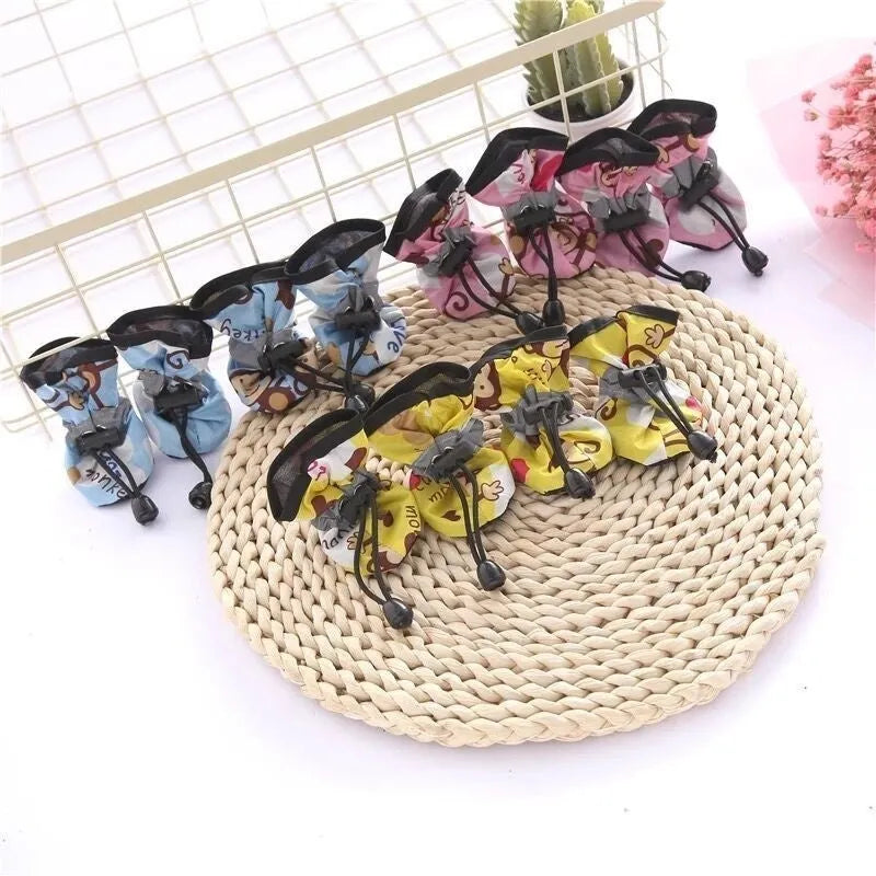 Four-season cloth dog shoes with soft soles and decorative monkey patterns