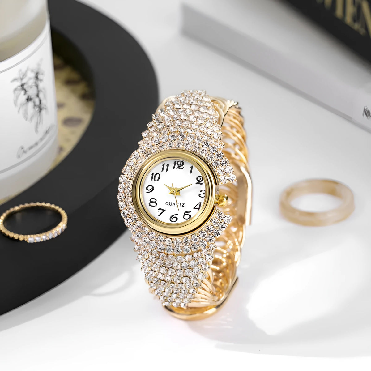 Women's 33mm quartz watch with circular dial, metal case, alloy strap, and open buckle