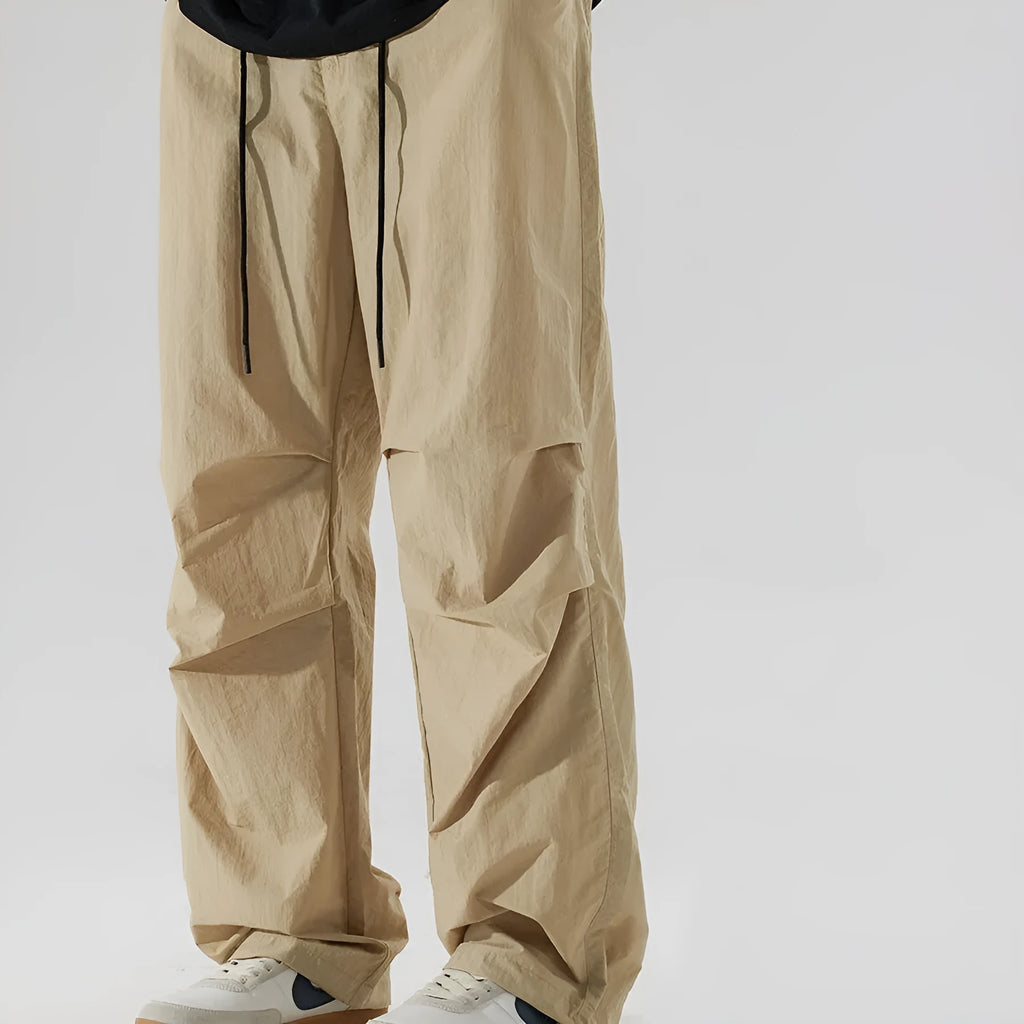Men's casual straight-leg trousers in thin ice silk nylon fabric showing loose fit and colour options