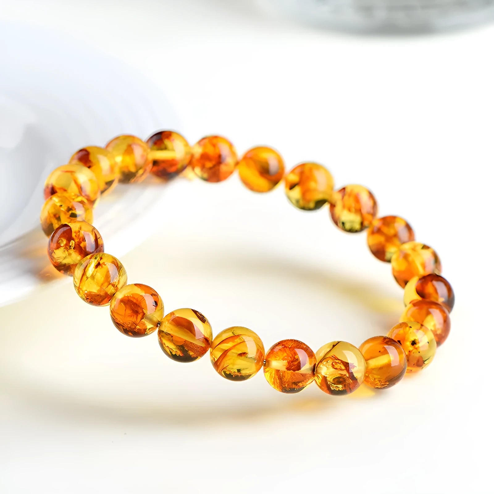 Natural yellow piebald amber bracelet with geometric beads in polished finish