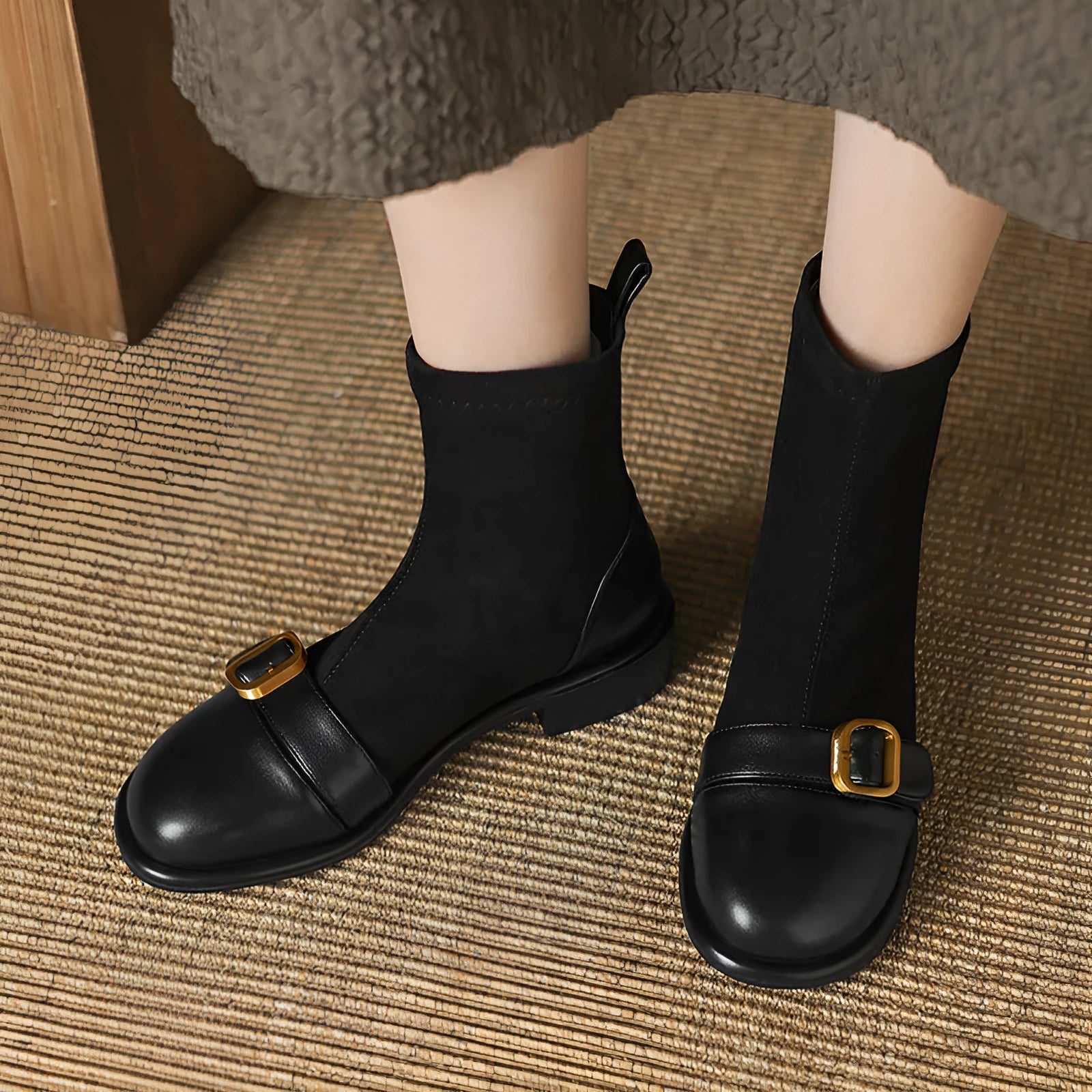 Black women's low heel Martin boots with front lace-up and buckle detail stitching.