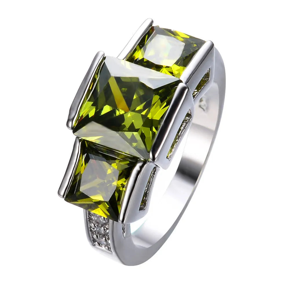 A set of colourful electroplated copper rings for women in sizes 6 to 10, showing apple green, champagne, and sapphire blue colours.