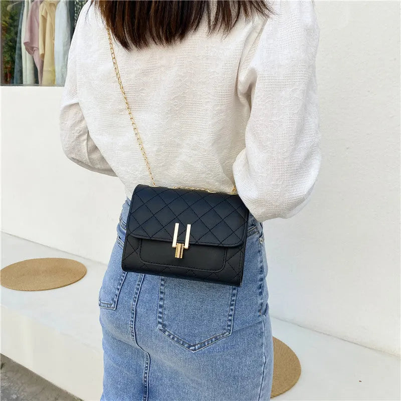 Women's white diamond lattice chain crossbody bag with adjustable shoulder strap showing dimensions