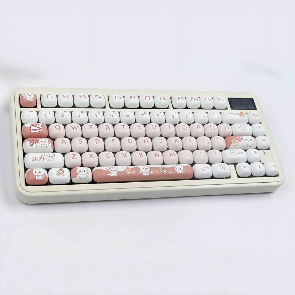 A single round MOG profile key cap with a sublimation printed cartoon dessert cat illustration.