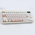A single round MOG profile key cap with a sublimation printed cartoon dessert cat illustration.