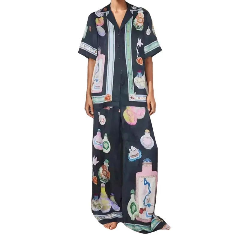 Women's black cardigan set with cartoon pattern, includes top and trousers