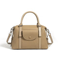 Genuine leather ladies handbag with contrast stitching and lock detail in elephant grey colour
