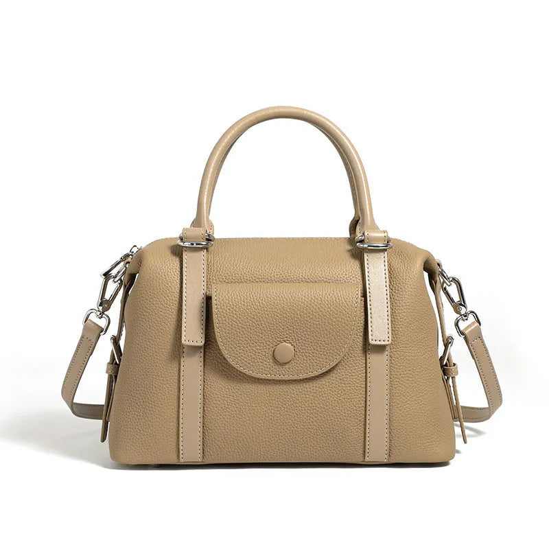 Genuine leather ladies handbag with contrast stitching and lock detail in elephant grey colour