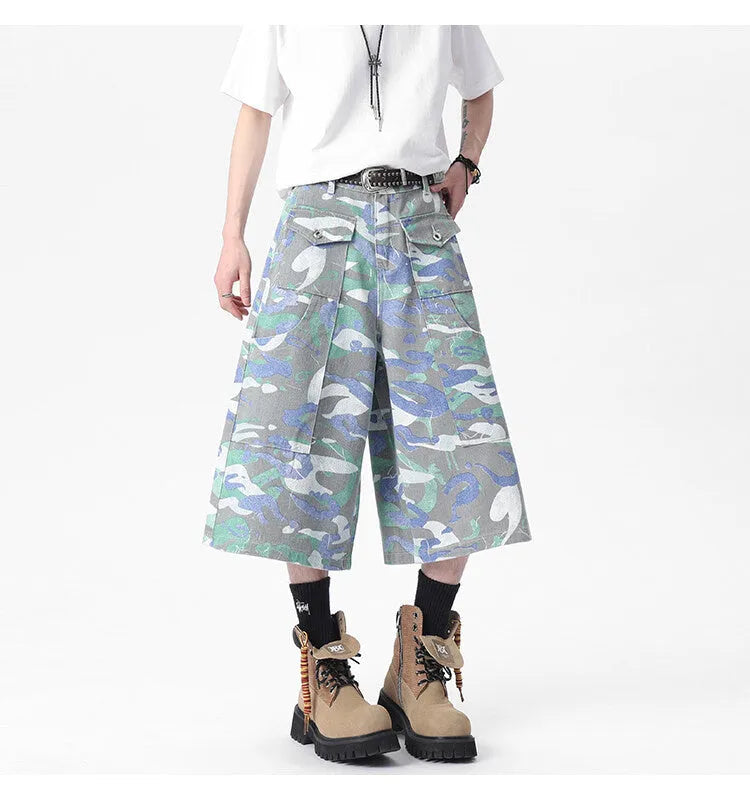 Men's camouflage colour denim cropped cargo trousers on a plain background