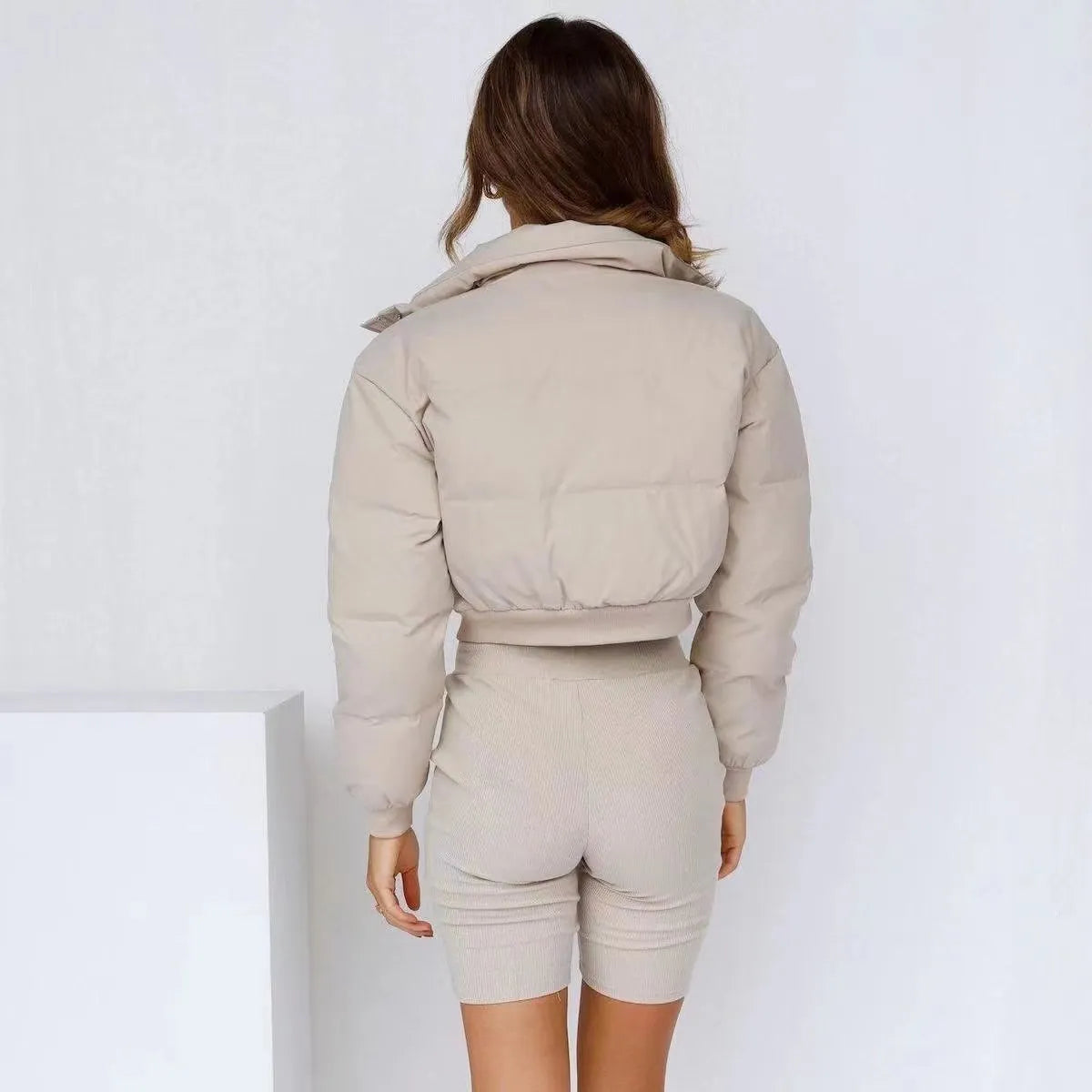 Loose fit women's polyester jacket in beige, black, or blue colour with long sleeves.