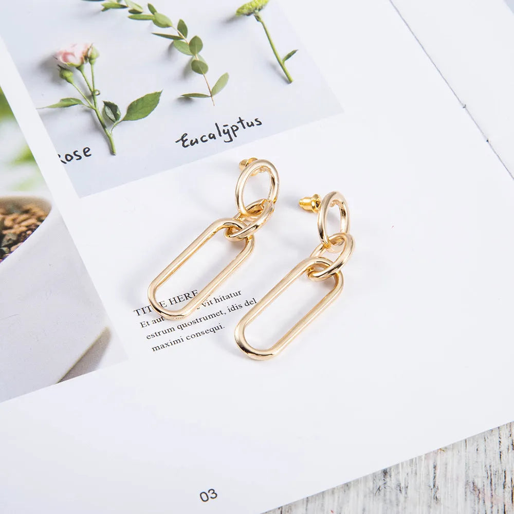 Sterling silver needle coloured geometric hoop earrings with ring and line design elements