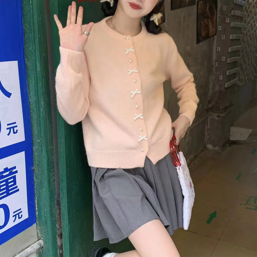 Women's cashmere cardigan sweater with pearl button bow detail in medium thickness for spring and autumn wear