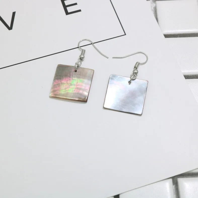 Women's geometric shell earrings in Square Panther and Rectangular Shell colours with retro natural styling