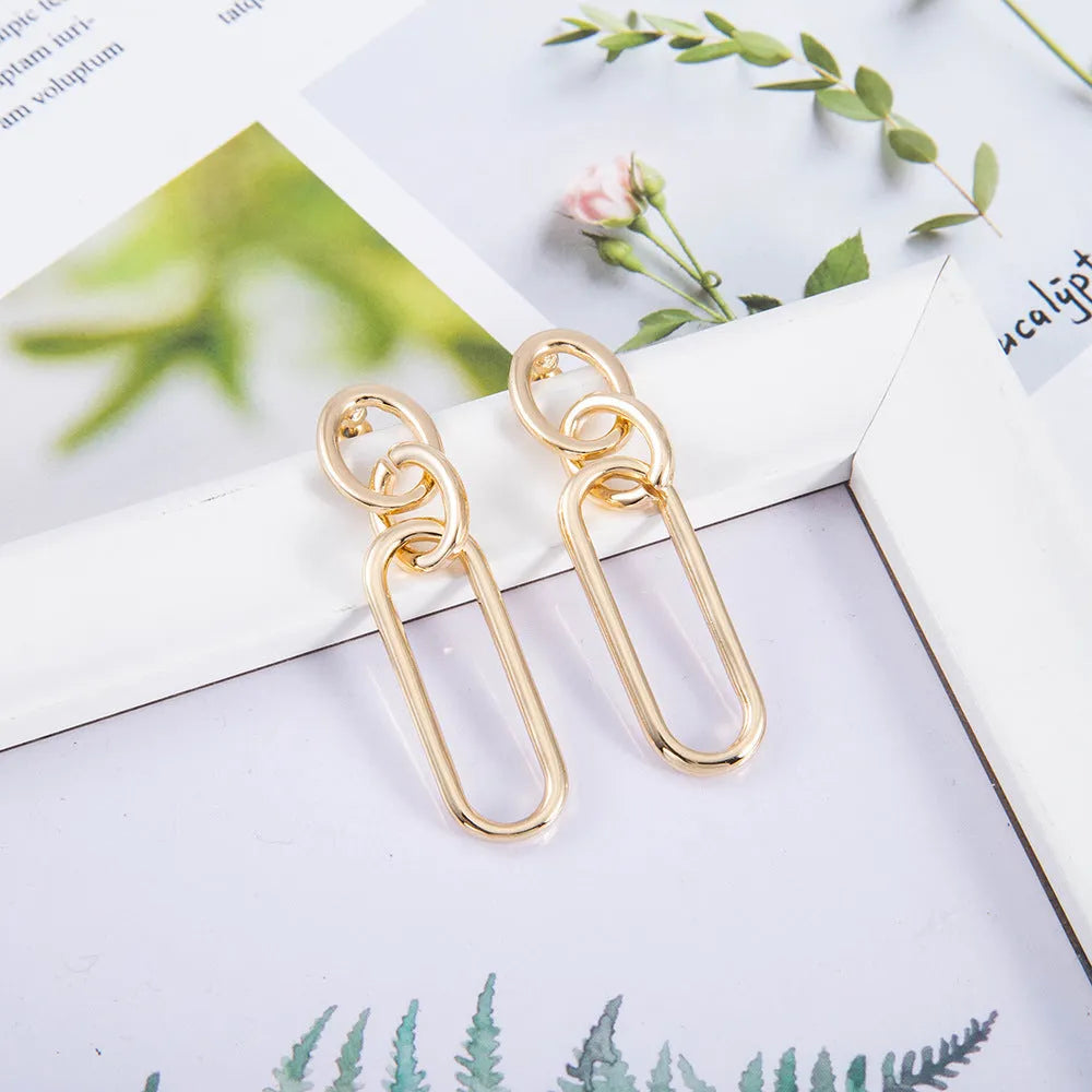 Sterling silver needle coloured geometric hoop earrings with ring and line design elements