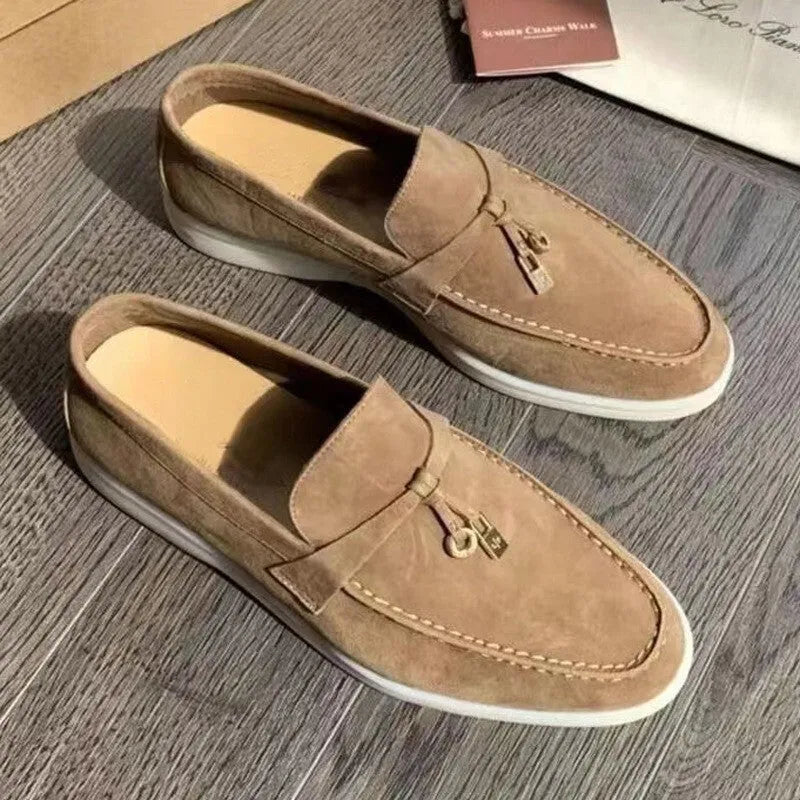 Slip-on high-top loafers in light gray with round toe and rubber sole.