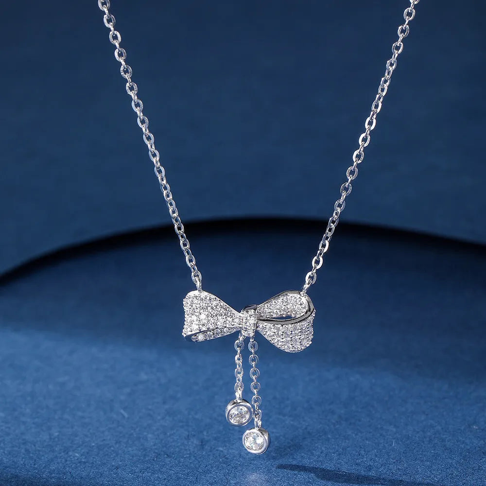Sterling silver bow pendant necklace on O-ring chain with adjustable 40-45cm length
