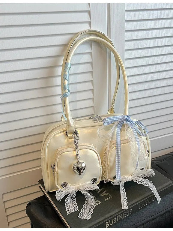 Large capacity soft PU leather shoulder bag in beige with crossbody straps and interior phone pocket